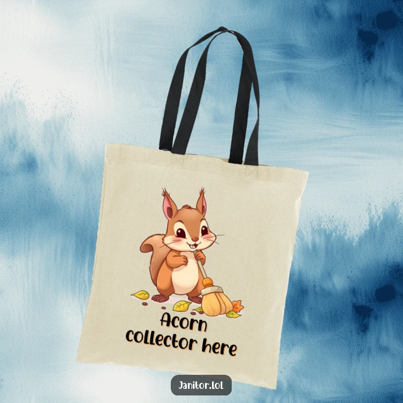 Funny squirrel tote bag showing a determined squirrel using a tiny broom to sweep up a pile of leaves.